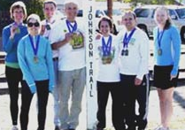 Julie Holmes on the left at the finish line of the Bizz Johnson Trail Marathon in Susanville CA