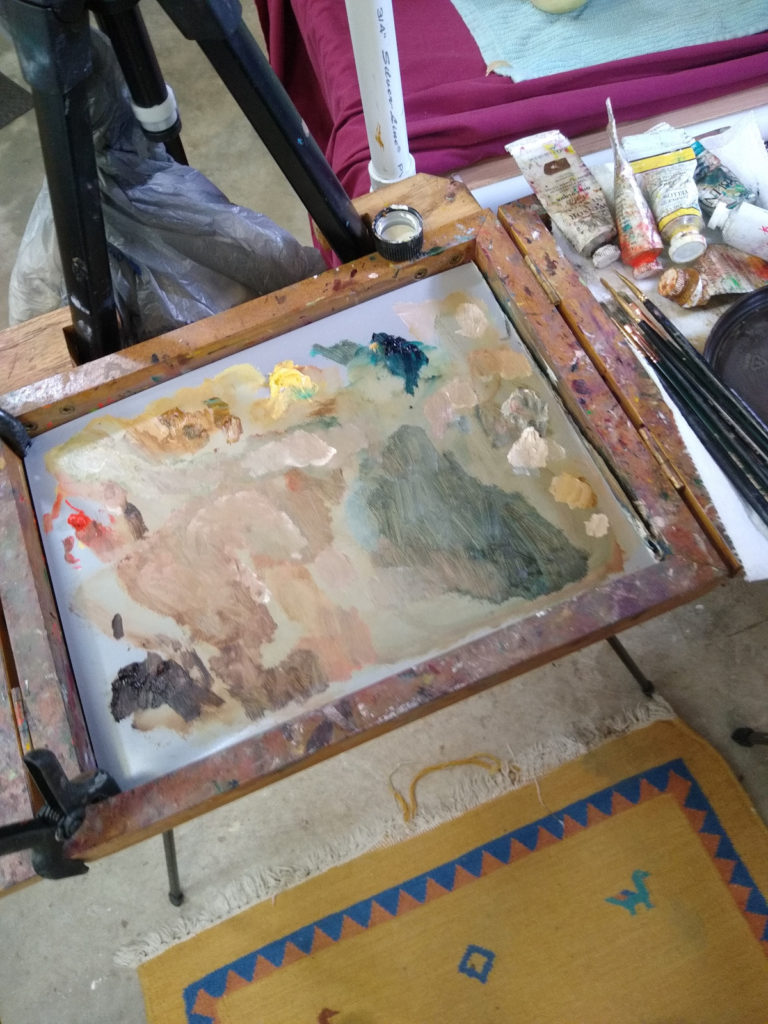 Limited palette in Julie Holmes studio where she paints weekly oil paintings