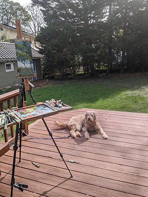 I hear you painting set up outdoors in our backyard